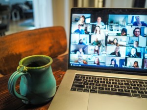 Photo of a computer open to a Zoom meeting