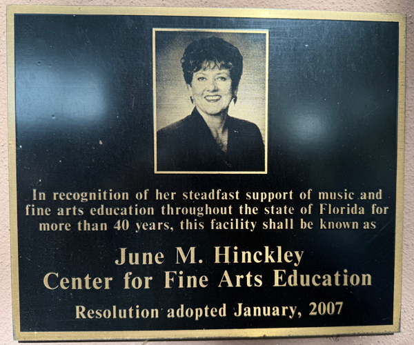 The plaque mounted on the outside of the June Hinckley Center for Fine Arts Education building in Tallahassee, Florida